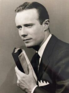 Town Village of Leawood | Man from 1950s holding a book