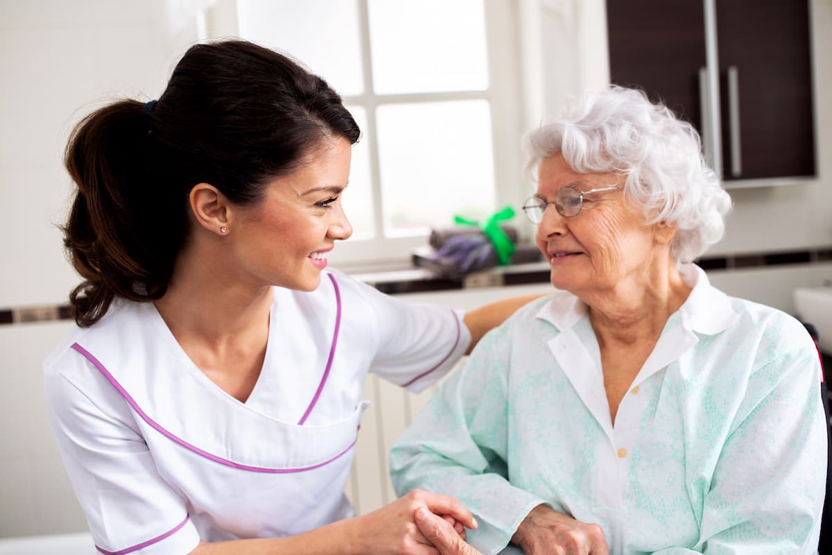 Tucson Place of Ventana Canyon | Long term care, Tucson, AZ - happy senior woman with caregiver