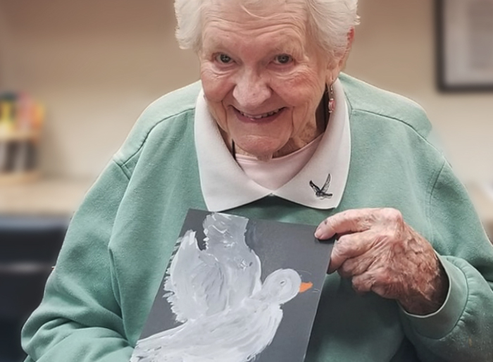 Tucson Place at Ventana Canyon | Resident with her painting