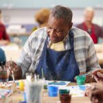 Tucson Place at Ventana Canyon | Senior man painting during art class