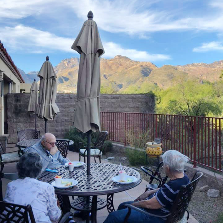 Tuscon Place at Ventana Canyon | Residents enjoying the view outside while snacking