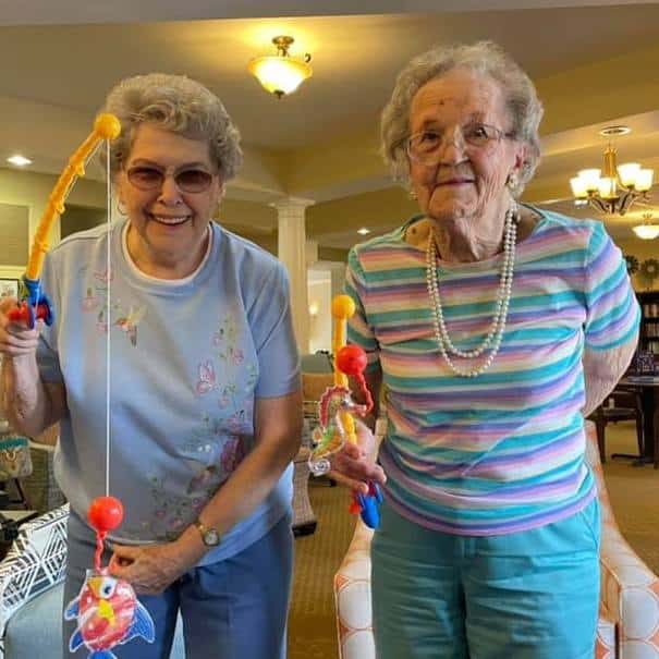 Whispering Winds of Apple Valley | Seniors playing with fishing crafts