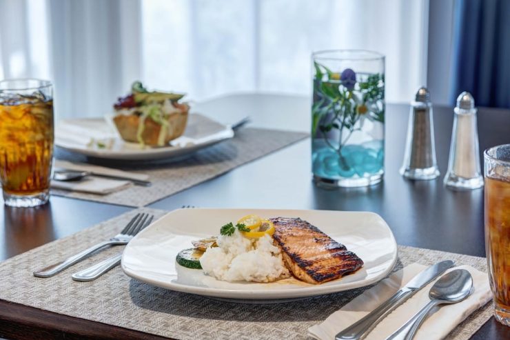 Whispering Winds of Apple Valley | Dinner plate with salmon and rice