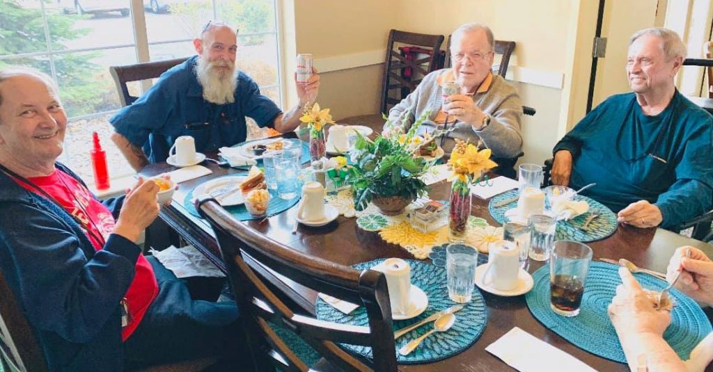 Pegasus Senior Living | Senior men at table