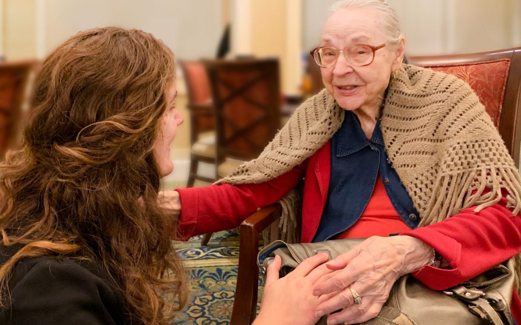 Pegasus Senior Living | Resident speaking to associate