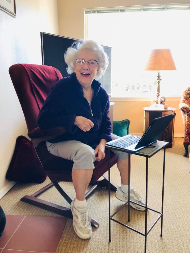 Pegasus Senior Living | Resident video chatting with family