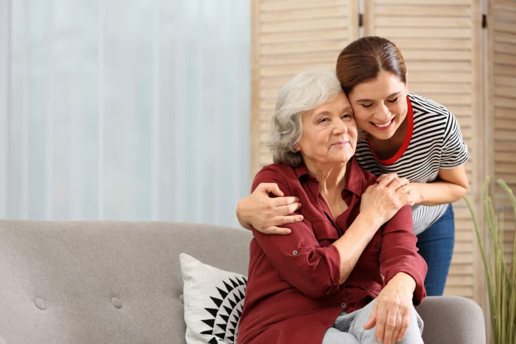 Pegasus Senior Living | Elderly woman with female caregiver in living room