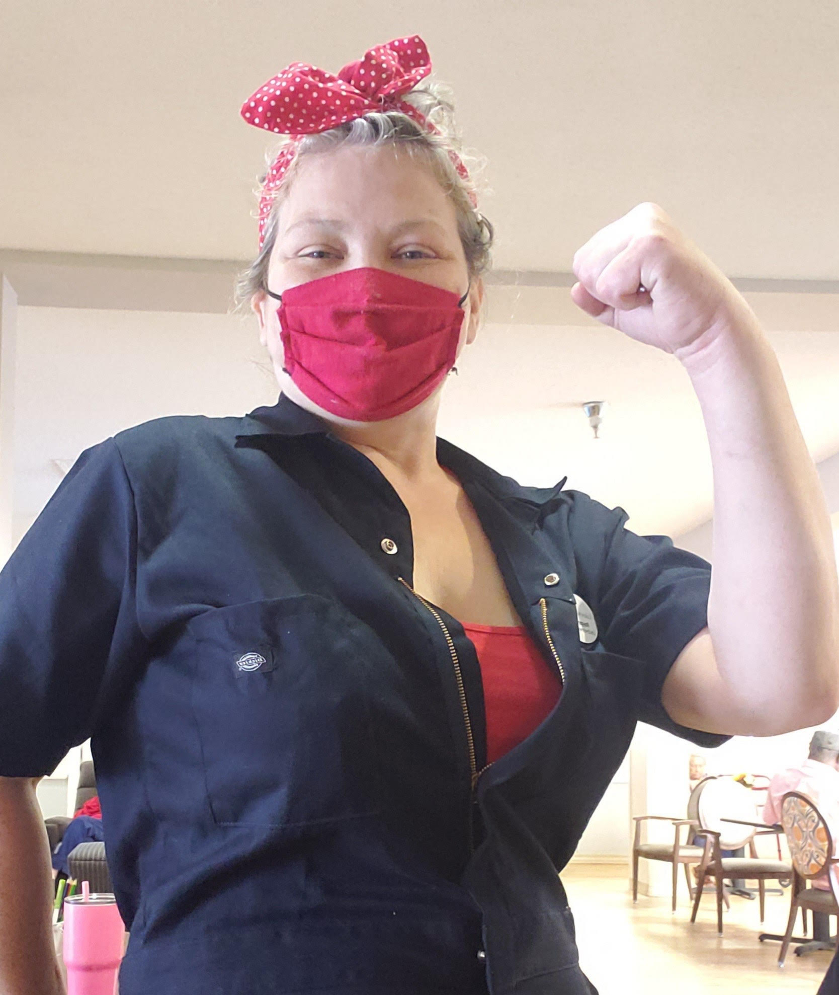 Pegasus Senior Living | Woman Flexing in Mask