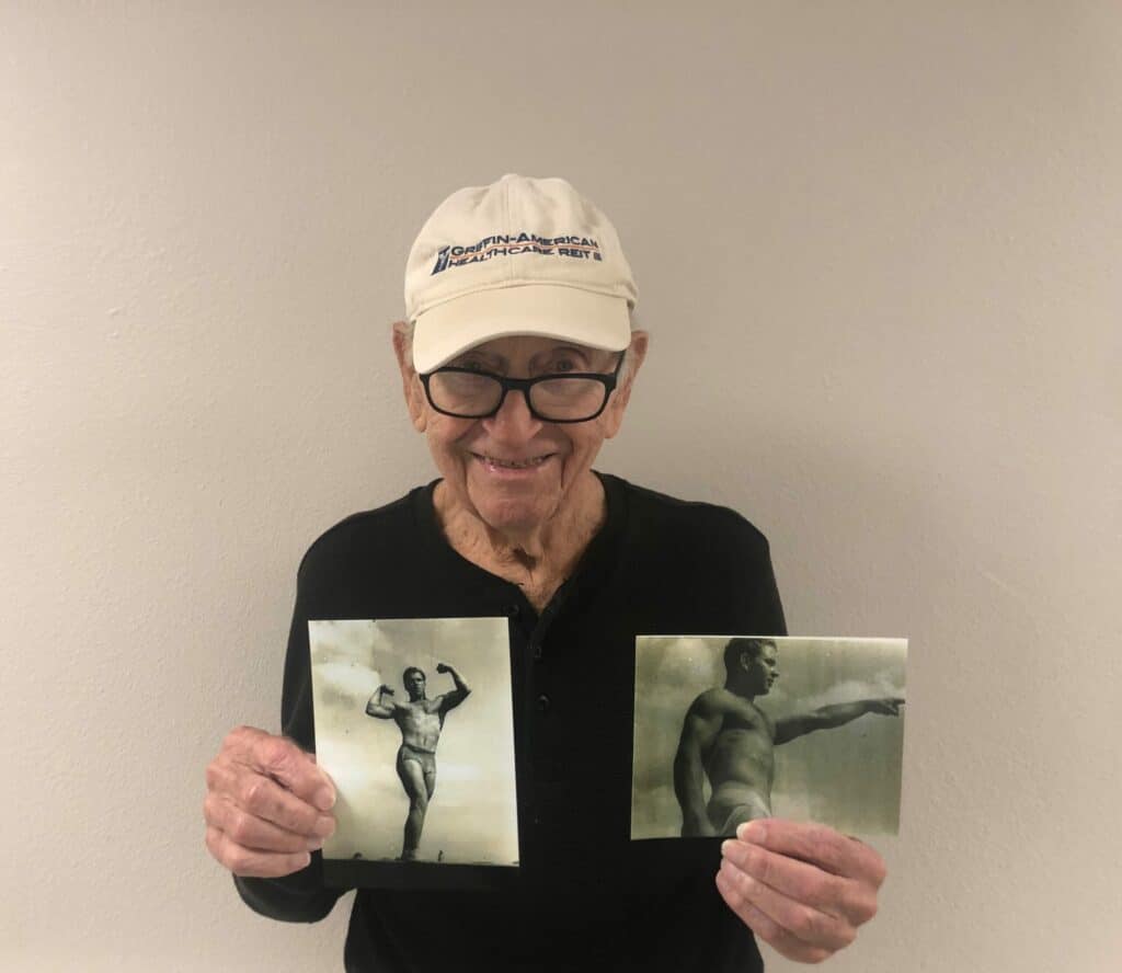 Pegasus Senior Living | Resident with his old bodybuilding photos