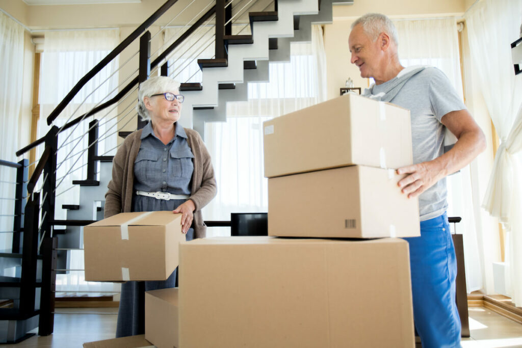 Town Village Crossing | Senior couple packing for a move