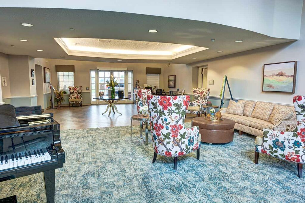 Laketown Village | Lobby with piano and seating