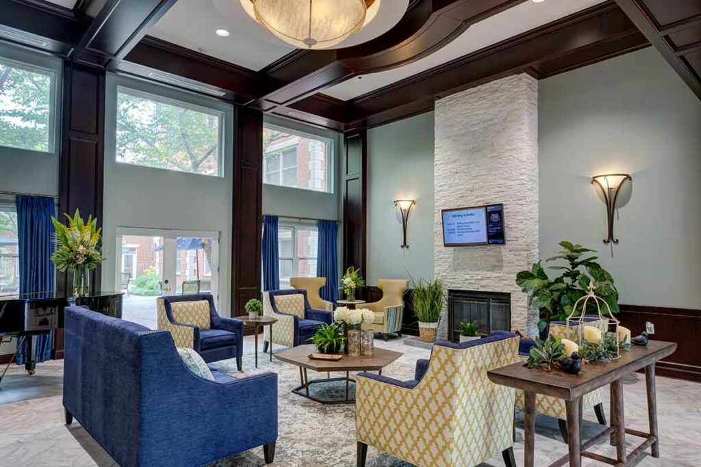 Dunwoody Place | Lobby with cushioned chairs and a tv