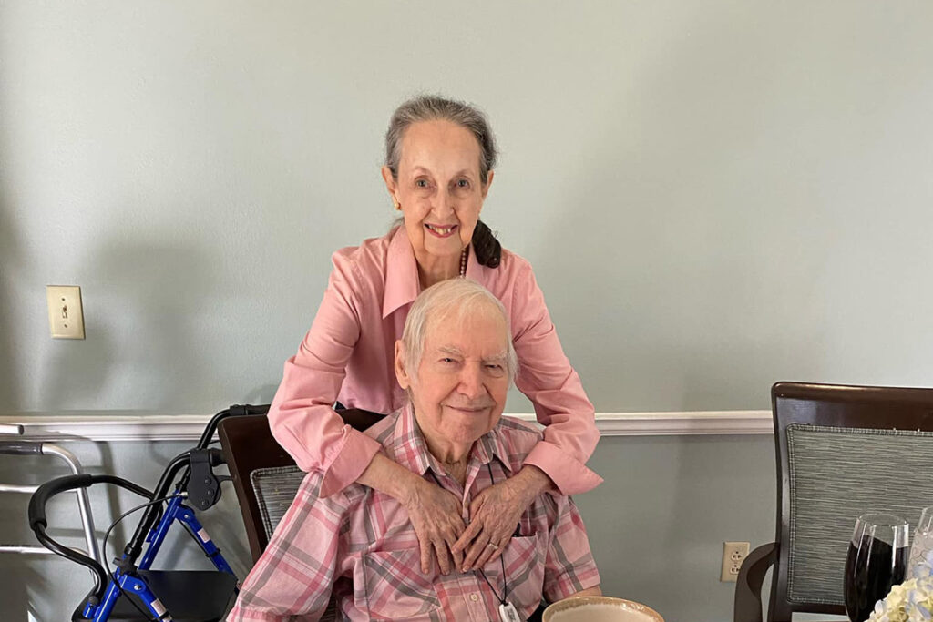 Laketown Village | Senior residents Rose and Earl hugging and smiling