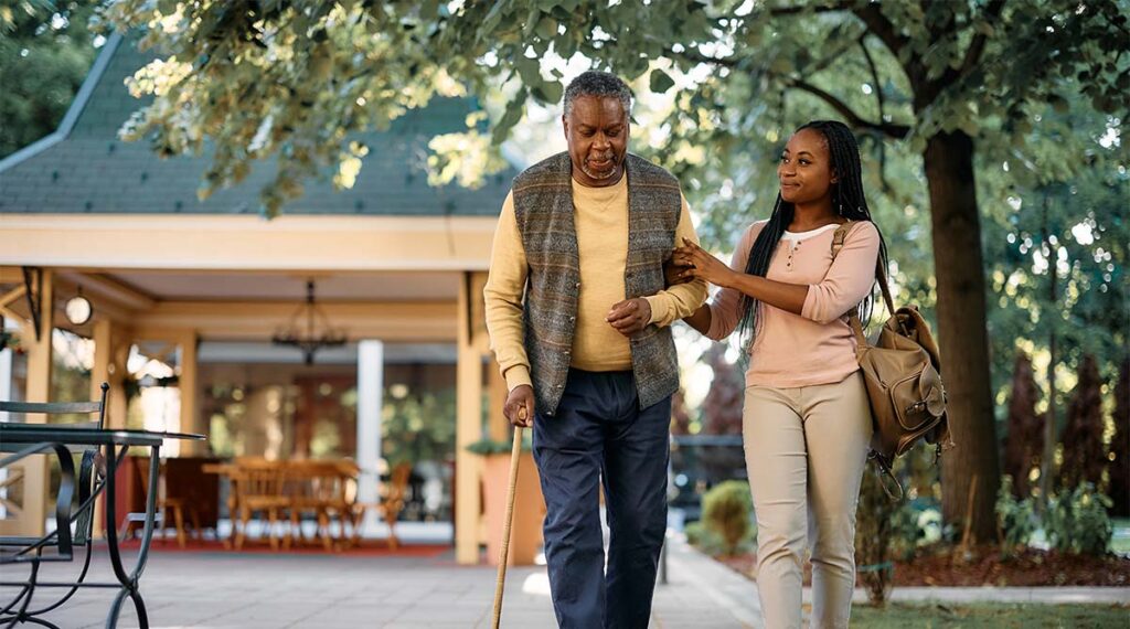 The Courtyards at Mountain View | Senior man and his daughter out for a walk