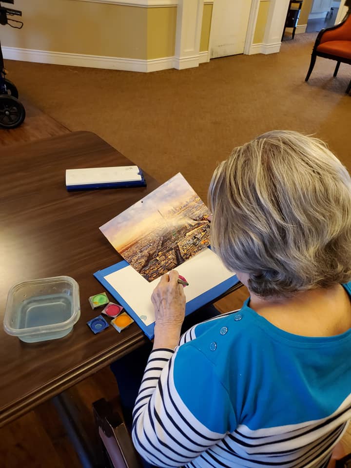 Belleview Suites at DTC | Senior painting at Belleview Suites Memory Care