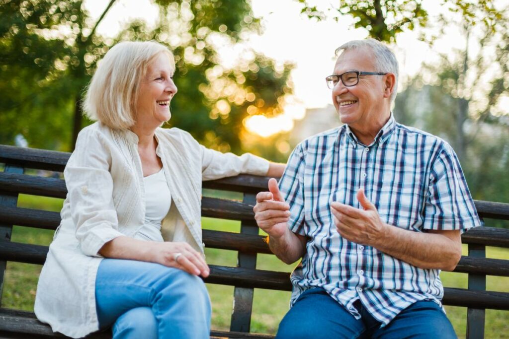 Queensbury | Seniors laughing on a park bench