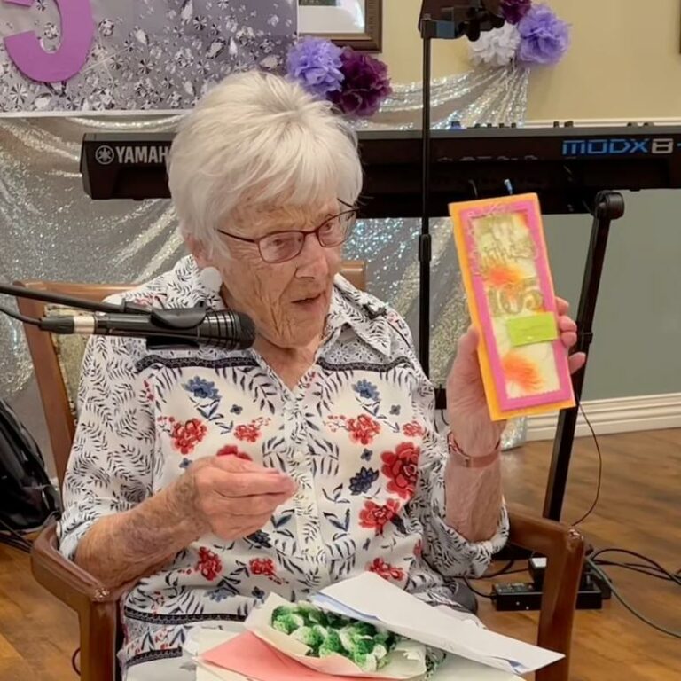 Broadway Mesa Village | Senior resident showing her birthday cards