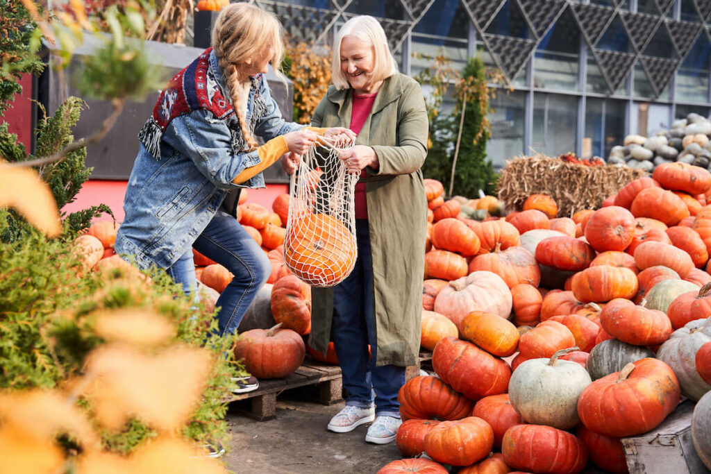 The Farrington at Tanglewood | Senior shopping at a farmers market buying a pumpkin