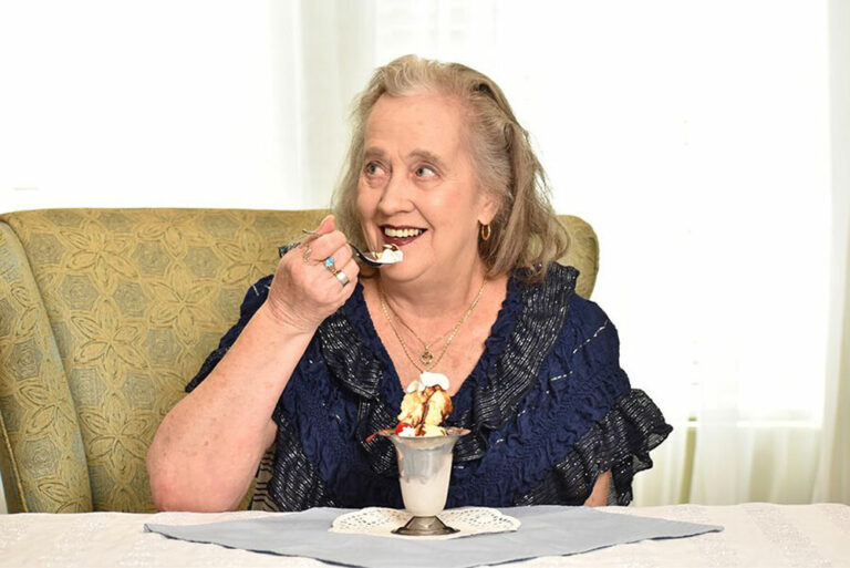 Broadway Mesa Village | Senior woman eating ice cream