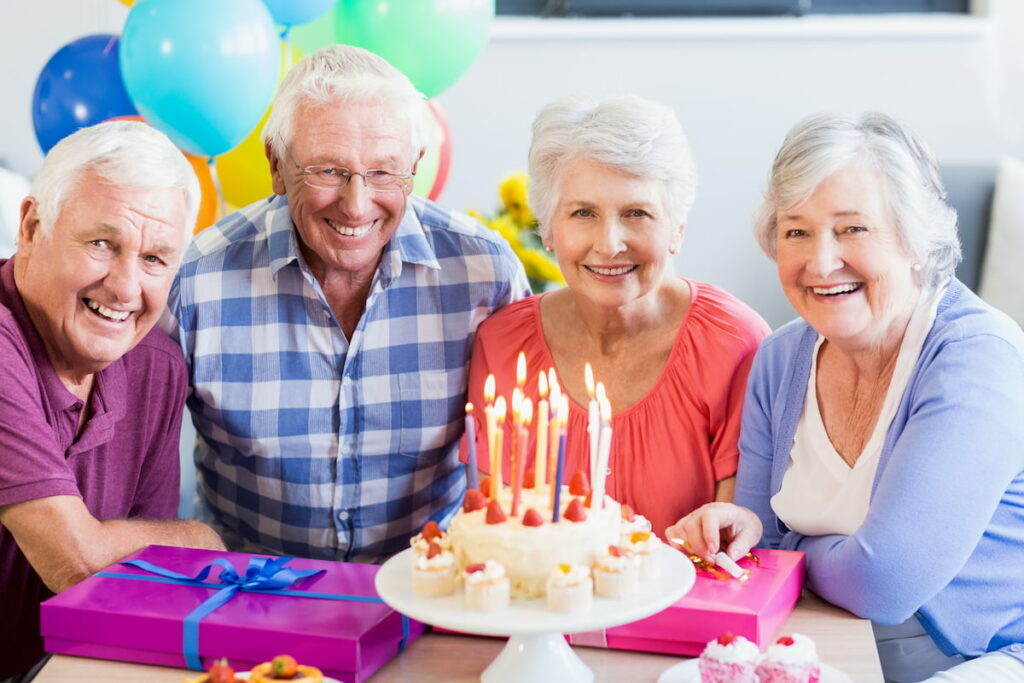South Hill Village | Seniors celebrating a birthday with cake