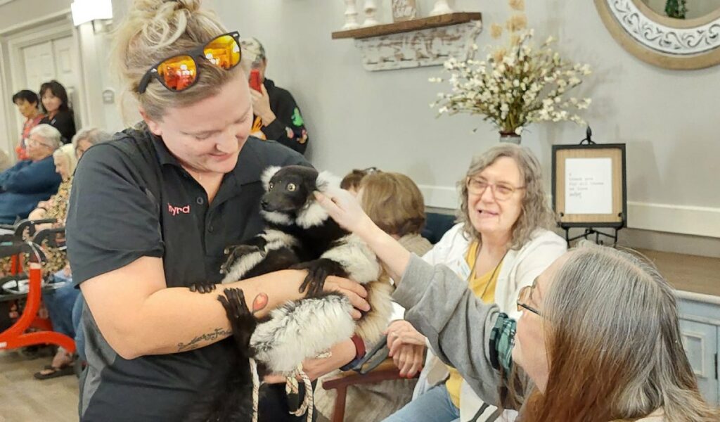 Ridgmar Place | Residents taking part in animal therapy