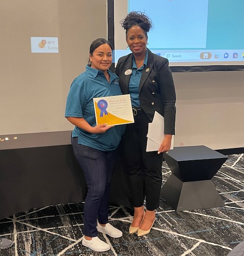 Pegasus Senior Living | Team members receiving their Connections Academy training certificate