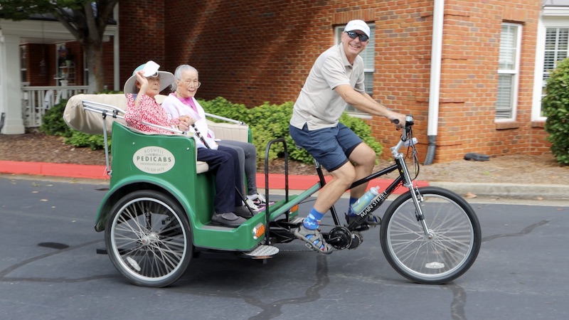 Pegasus Senior Living | Video thumbnail of seniors in a bike-drawn carriage