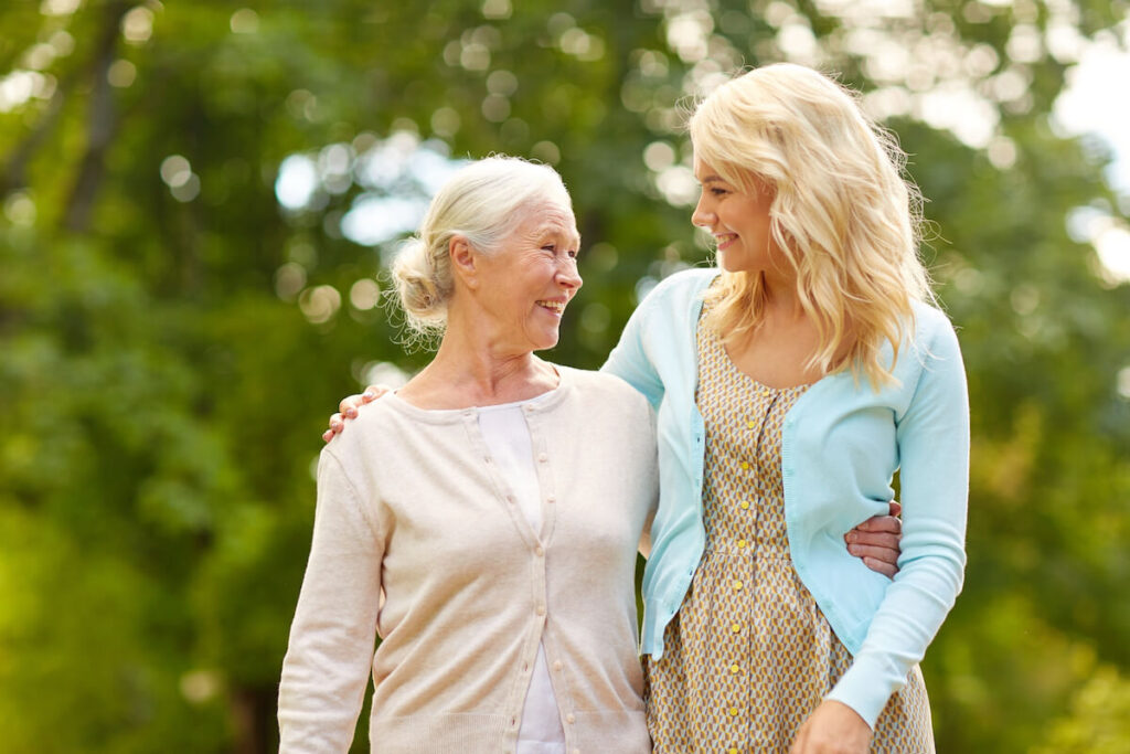 The Oaks at Inglewood | Senior woman and her daughter talking a walk outside