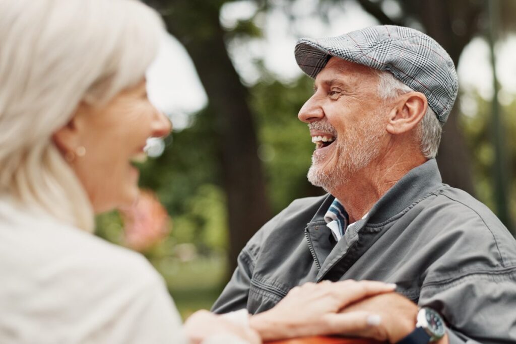 Pegasus Senior Living | Seniors laughing on a park bench